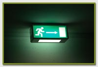 green emergency lighting sign showing the exit